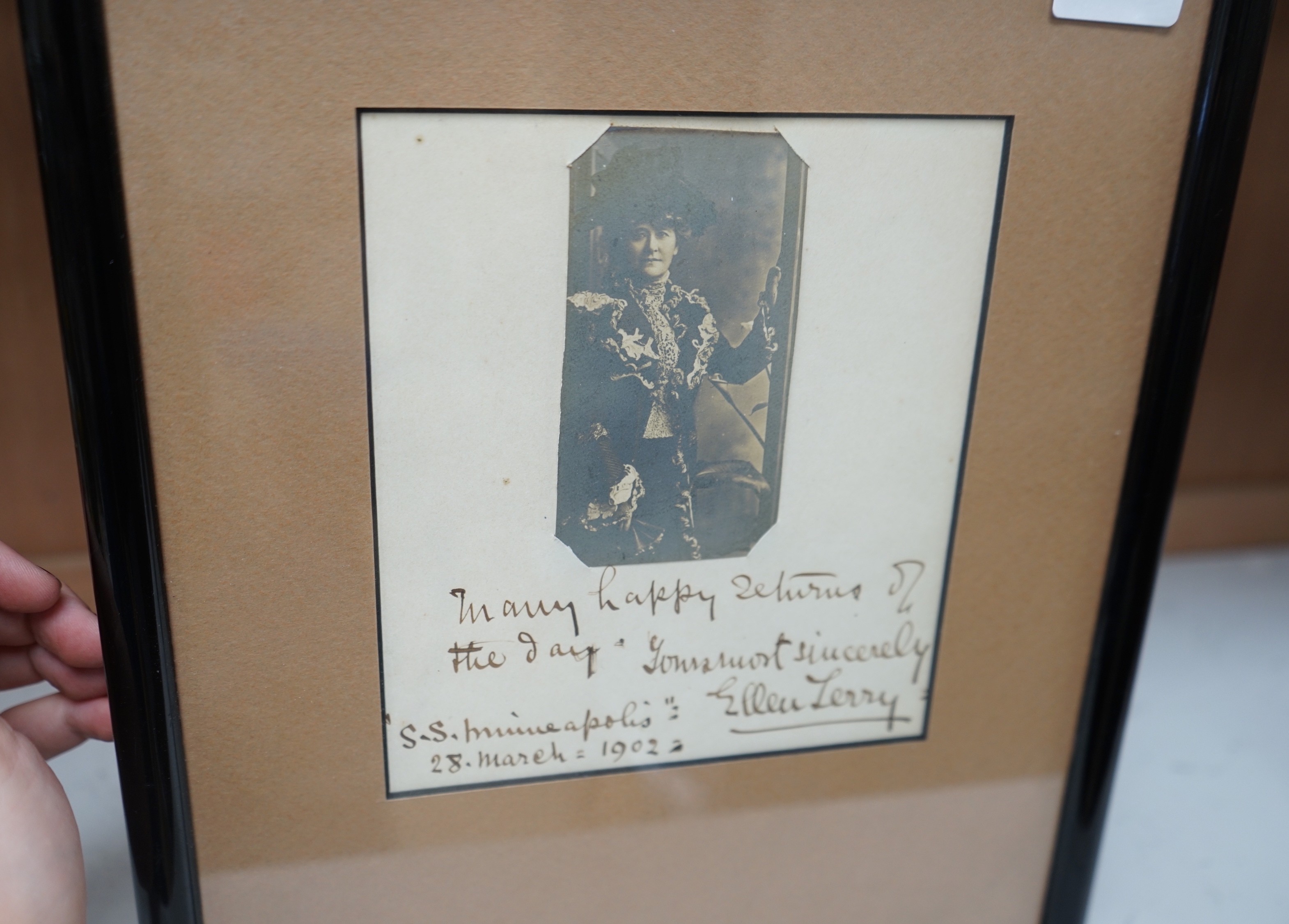 A framed Ellen Terry photograph, with autograph, dated “S.S. Minneapolis” 28. March=1902, 23.5cms wide x 29cms high